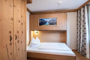 Posteľ alebo postele v izbe v ubytovaní Alpenhotel Kramerwirt