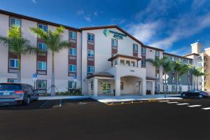 a rendering of a hotel with a parking lot at WoodSpring Suites Miramar in Miramar