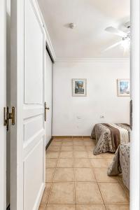 Łóżko lub łóżka w pokoju w obiekcie Apartamentos la Mar