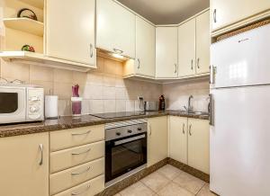 Kuchnia lub aneks kuchenny w obiekcie Apartamentos la Mar