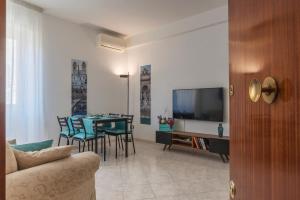 A television and/or entertainment centre at San Giovanni Apartment with Balcony