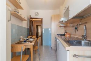 A kitchen or kitchenette at San Giovanni Apartment with Balcony