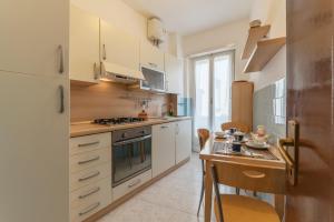 A kitchen or kitchenette at San Giovanni Apartment with Balcony