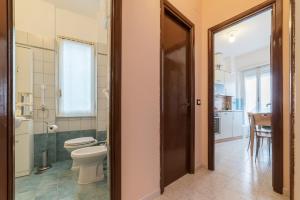 A bathroom at San Giovanni Apartment with Balcony