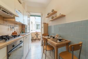 A kitchen or kitchenette at San Giovanni Apartment with Balcony