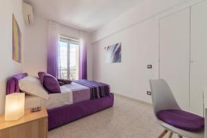 A bed or beds in a room at San Giovanni Apartment with Balcony