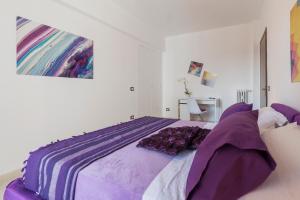 A bed or beds in a room at San Giovanni Apartment with Balcony