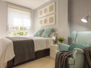 A bed or beds in a room at Misterhost San Bernardo Jardines de Murillo