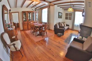 a living room with a table and a dining room at Apartamentos Francisco Martins in Vila Franca do Campo