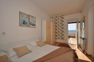Postel nebo postele na pokoji v ubytování Anastazija sea View + 37 fotografií