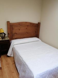 Ένα ή περισσότερα κρεβάτια σε δωμάτιο στο Casa Rural Calecha