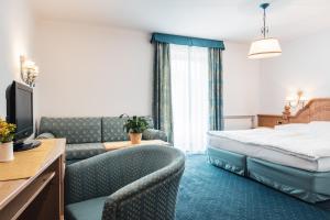 Posteľ alebo postele v izbe v ubytovaní Hotel Chalet Corso