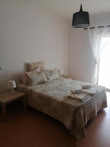 Een bed of bedden in een kamer bij Villa Estrelinha