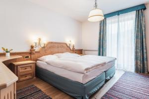 Posteľ alebo postele v izbe v ubytovaní Hotel Chalet Corso
