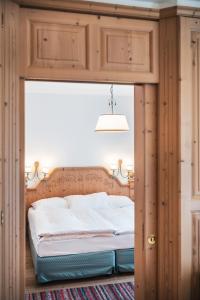 Posteľ alebo postele v izbe v ubytovaní Hotel Chalet Corso