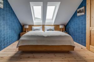 Posteľ alebo postele v izbe v ubytovaní Hotel Na Rozcestí
