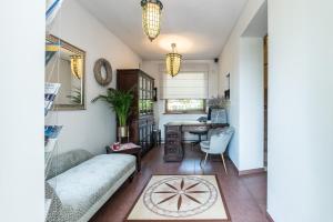 a living room with a couch and a table at Villa Gdynia in Gdynia