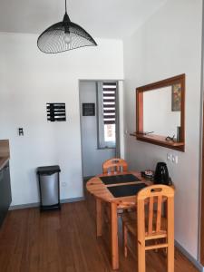 a dining room with a table and two chairs at Les Néréides in Mers-les-Bains +6 photos