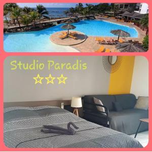 a hotel room with a bed and a swimming pool at Studio Paradis 3* in Saint-François