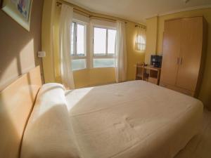 Postel nebo postele na pokoji v ubytování Hostal Meseguer