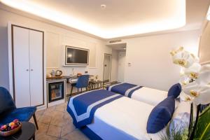a hotel room with two beds and a fireplace at Endican Beyazit Hotel in Istanbul