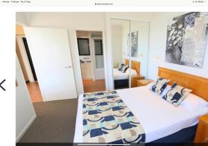 Postel nebo postele na pokoji v ubytování Ocean Courtyard - Beachside Unit + 13 fotografií