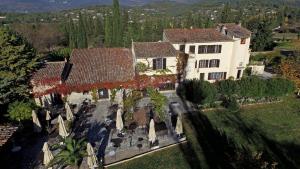 an aerial view of a large house with trees at Hotel-Restaurant Le Moulin De La Camandoule in Fayence