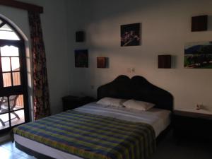 Postel nebo postele na pokoji v ubytování Wunderbar Beach Hotel