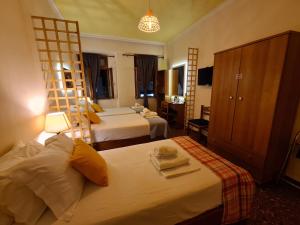 Posteľ alebo postele v izbe v ubytovaní Nikolas Rooms