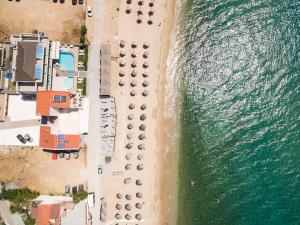an overhead view of a beach and the ocean at Xenia Suites in Limenaria