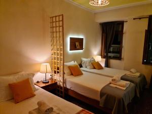 Posteľ alebo postele v izbe v ubytovaní Nikolas Rooms