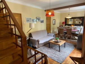 a living room with a couch and a table at Casa de Manteigas in Manteigas