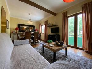 a living room with a couch and a table at Casa de Manteigas in Manteigas