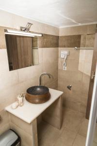 a bathroom with a sink and a shower at YourCastle in Alexandroupoli