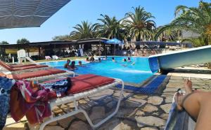 The swimming pool at or close to Pension Nychterida
