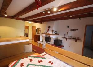 a bedroom with a bed and a fireplace at Vlašićki Konak in Vlasic