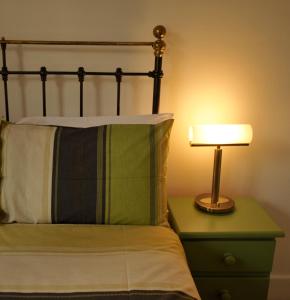 A bed or beds in a room at Linden Guest House 