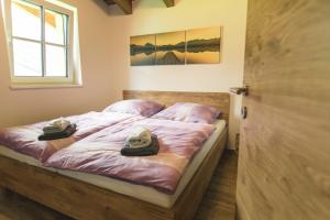 Postel nebo postele na pokoji v ubytování Alpin Lodge Kitzblick