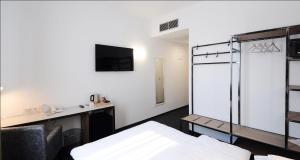 Postel nebo postele na pokoji v ubytování Best Western Airport Hotel Stella