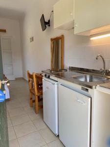 a kitchen with a sink and a counter top at Anemona Studios in Paleokastritsa