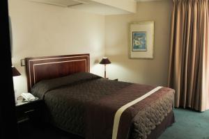 Cama o camas de una habitación en Hotel Leonardo da Vinci