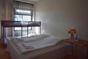 Postel nebo postele na pokoji v ubytování Arkadia Hotel & Hostel