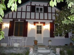 a house with a table in front of it at Les Charmettes in Mers-les-Bains