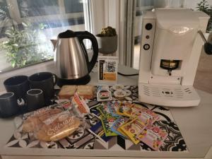 a counter top with a coffee maker and some food at Italians b&b luxury suite in Acquaviva delle Fonti