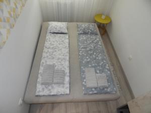 A bed or beds in a room at Pisztácia 2020 Apartman