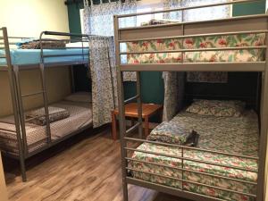 a room with two bunk beds and a bed at LAX guest house in Inglewood
