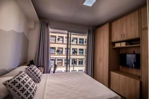Ένα ή περισσότερα κρεβάτια σε δωμάτιο στο 360 Luz