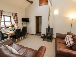 Et opholdsområde på Stable Cottage