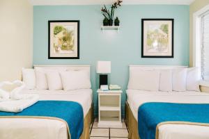 Säng eller sängar i ett rum på Seashell Motel and International Hostel