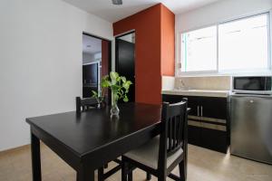 Kuchyň nebo kuchyňský kout v ubytování Gayser Apartamentos
